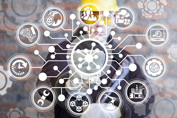 Hub Network Connection Industry 4.0. Industrial engineer clicks a atom structure icon surrounded by specific circuit components. Cyber Manufacturing Networking Digital System.