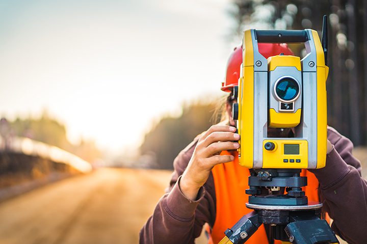 Surveyor engineer with equipment (theodolite or total positionin