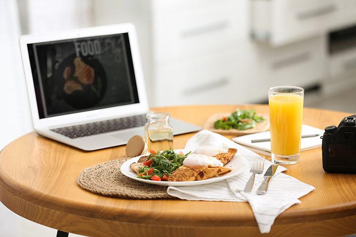 Delicious lunch served on table with laptop. Food blog