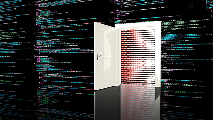 Door in a wall in a black room painted with computer code