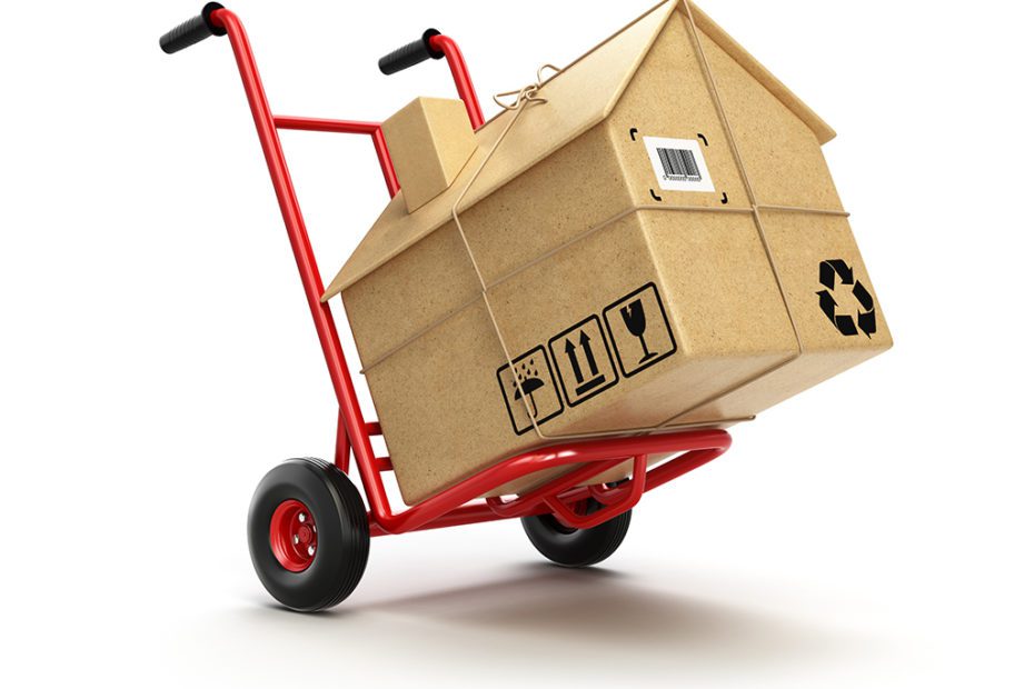 Delivery or moving houseconcept. Hand truck with cardboard box a