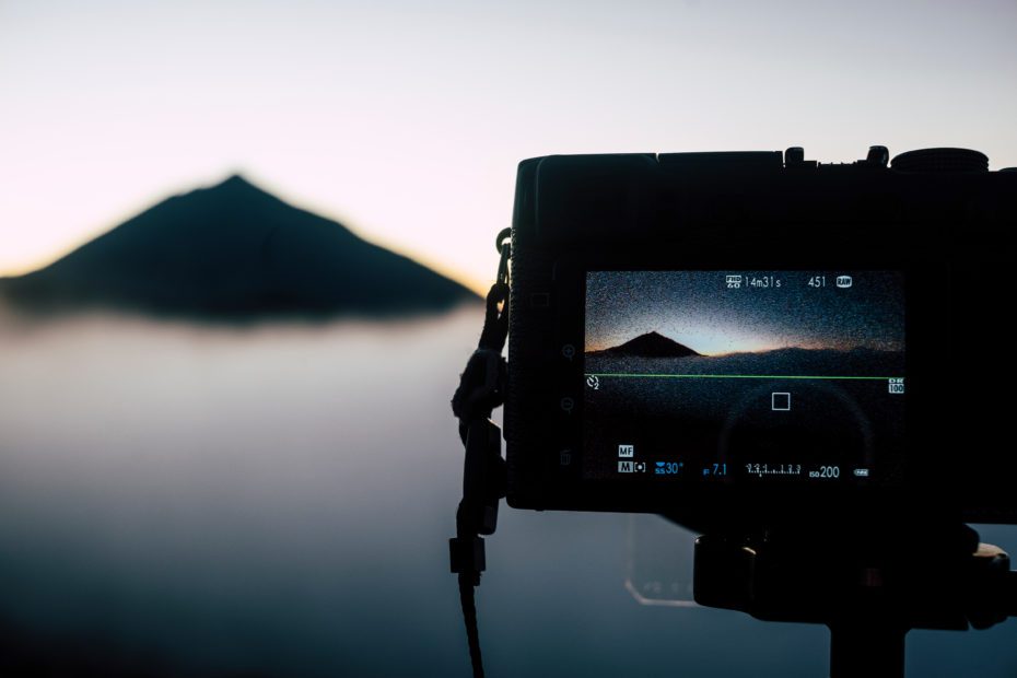 Close up of photography display camera showing beautiful landsca