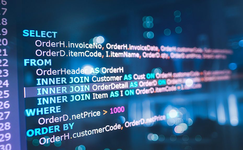 SQL (Structured Query Language) code on computer monitor and server room background. Example of SQL code to query data from a database.