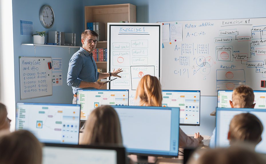 Elementary School Class: Teacher Uses Interactive Digital Whiteb