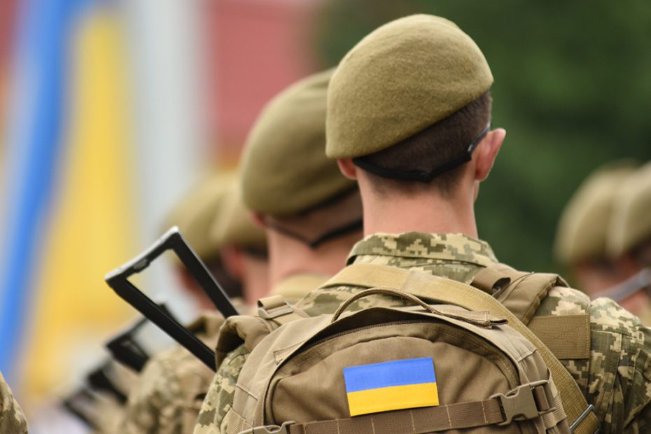 Ukrainian soldier. Ukrainian in army. Ukrainian flag on military