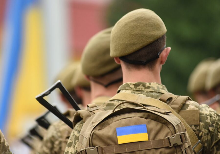 Ukrainian soldier. Ukrainian in army. Ukrainian flag on military